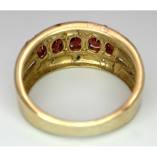 321 - A 9K YELLOW GOLD, DIAMOND AND GARNET SET RING. 4G SIZE M. SC5069