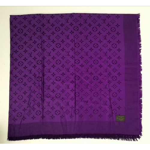 371 - A Louis Vuitton Purple Silk Scarf. LV monogram decoration. 
145cm x 75cm. Silk and wool mix. Italian... 