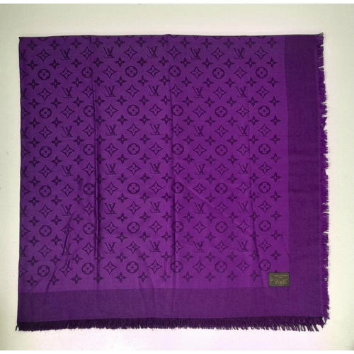 371 - A Louis Vuitton Purple Silk Scarf. LV monogram decoration. 
145cm x 75cm. Silk and wool mix. Italian... 