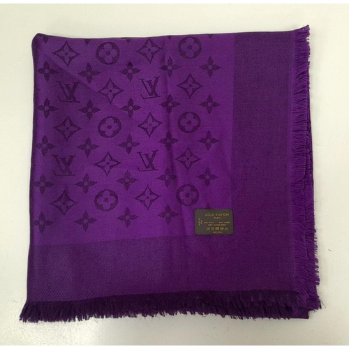 371 - A Louis Vuitton Purple Silk Scarf. LV monogram decoration. 
145cm x 75cm. Silk and wool mix. Italian... 