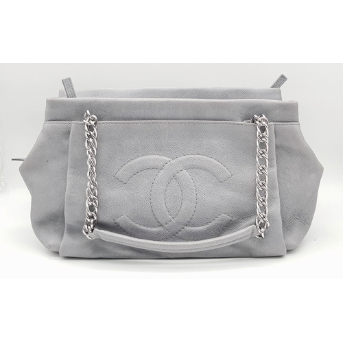 39 - A Chanel Grey Leather Shoulder Bag. Classic Double C exterior logo with silver tone and leather hand... 