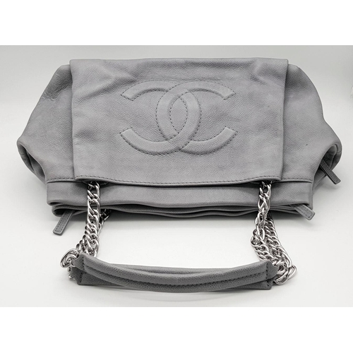 39 - A Chanel Grey Leather Shoulder Bag. Classic Double C exterior logo with silver tone and leather hand... 