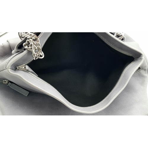 39 - A Chanel Grey Leather Shoulder Bag. Classic Double C exterior logo with silver tone and leather hand... 