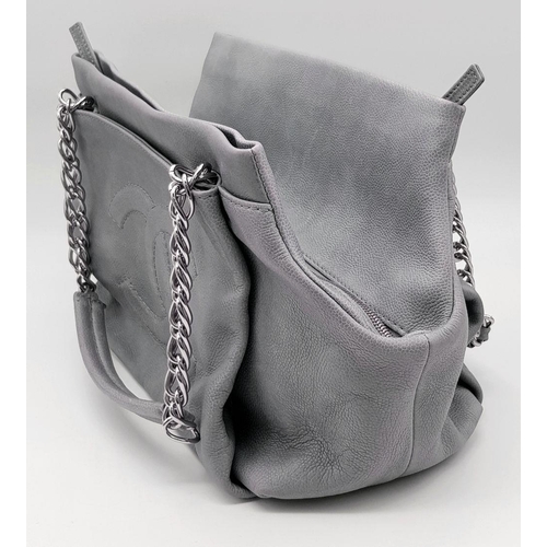 39 - A Chanel Grey Leather Shoulder Bag. Classic Double C exterior logo with silver tone and leather hand... 