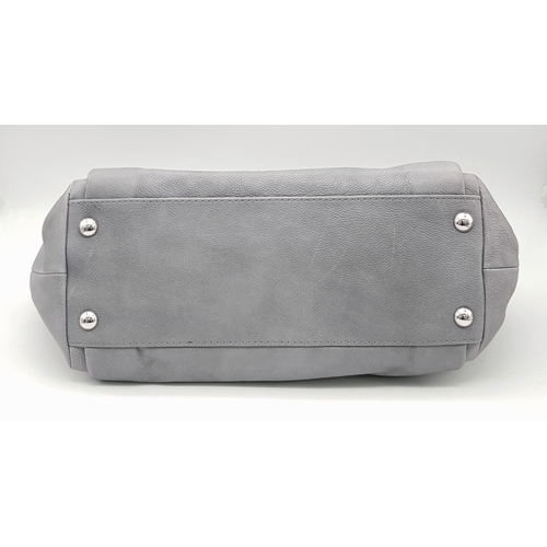 39 - A Chanel Grey Leather Shoulder Bag. Classic Double C exterior logo with silver tone and leather hand... 