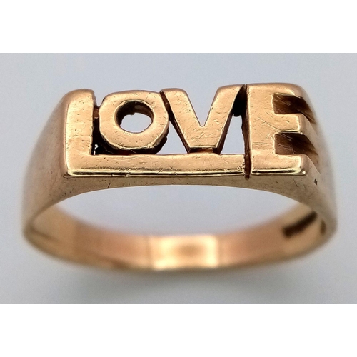 425 - A 9K YELLOW GOLD 'LOVE' RING. 3.5G. SIZE Q. SC5033