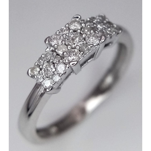 467 - A 9K WHITE GOLD TRIPLE SEGMENT DIAMOND CLUSTER RING. 0.25CT. 1.7G. SIZE I. SC5045