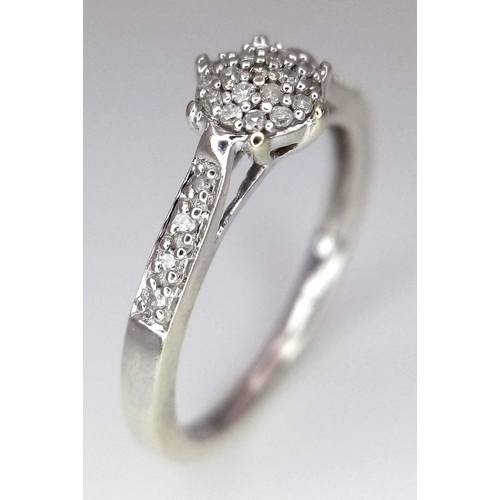 515 - A 9K WHITE GOLD DIAMOND RING. 1.8G. SIZE K. SC5002