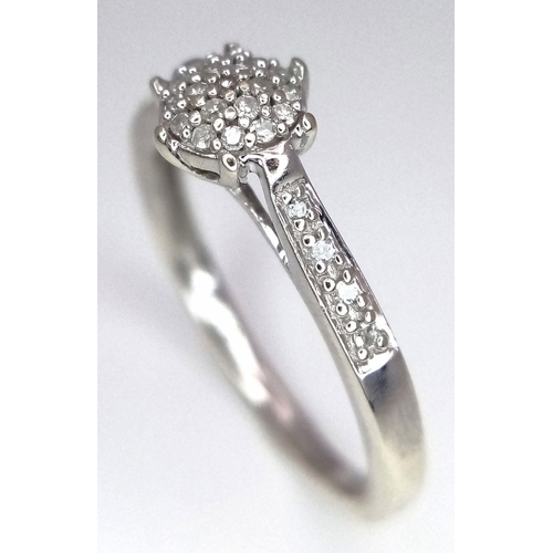 515 - A 9K WHITE GOLD DIAMOND RING. 1.8G. SIZE K. SC5002