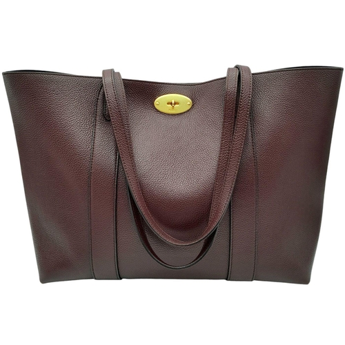 60 - A Mulberry Burgundy Leather Tote Bag. Burgundy leather exterior with gold-toned hardware and an open... 