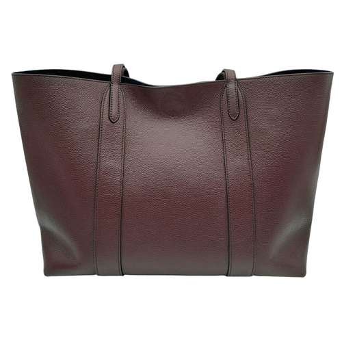 60 - A Mulberry Burgundy Leather Tote Bag. Burgundy leather exterior with gold-toned hardware and an open... 