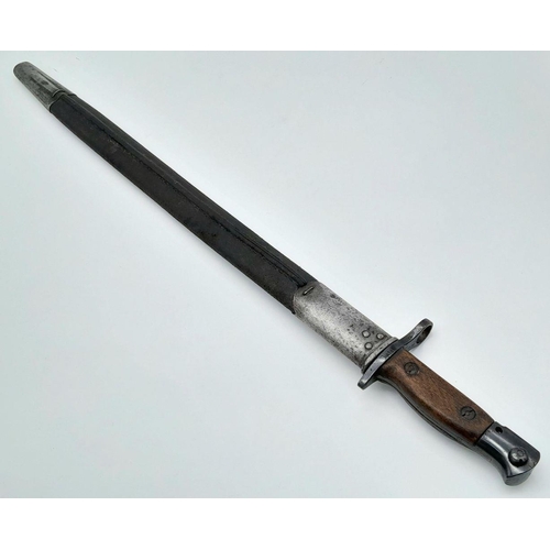 687 - A WW1 SMLE Bayonet with Scabbard. 1917 marking. 58cm total length.