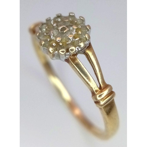 698 - A 9K YELLOW GOLD DIAMOND SET CLUSTER RING. 1.6G. SIZE R. SC5022.