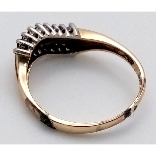 705 - A 9K YELLOW GOLD DIAMOND TWO ROW TWIST RING. 1.7G. SIZE L 1/2. SC5024