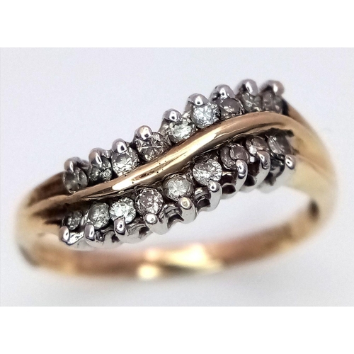 705 - A 9K YELLOW GOLD DIAMOND TWO ROW TWIST RING. 1.7G. SIZE L 1/2. SC5024