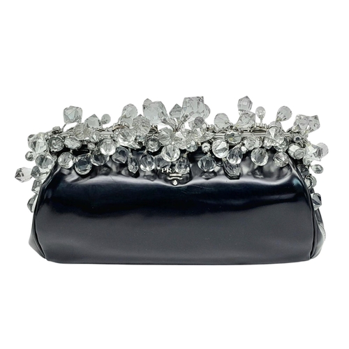 74 - A Prada Black Patent Leather Crystal Embellished Clutch Bag. Patent leather exterior adorned with cr... 