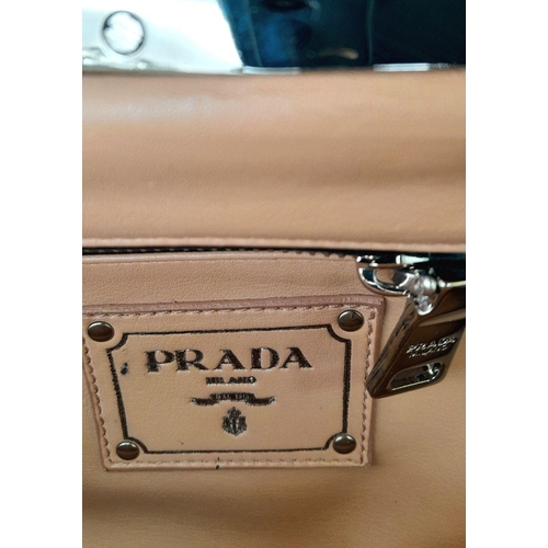 74 - A Prada Black Patent Leather Crystal Embellished Clutch Bag. Patent leather exterior adorned with cr... 