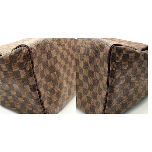 88 - A Louis Vuitton Speedy Damier Bag. Brown checked LV coated canvas exterior. Gold tone furniture. Red... 