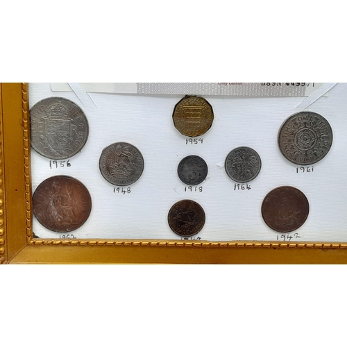 947 - A Framed Small Coin and Note Collection - Includes a mint ten shilling note. In frame - 28cm x 34cm.