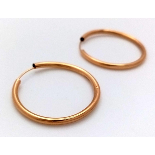 982 - A Pair of 9K Yellow Gold Hoop Earrings. 25mm. 0.75g