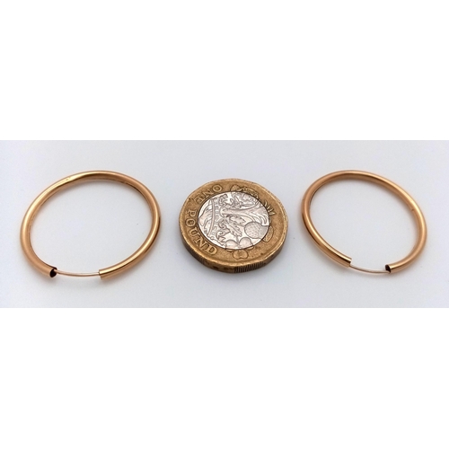 982 - A Pair of 9K Yellow Gold Hoop Earrings. 25mm. 0.75g