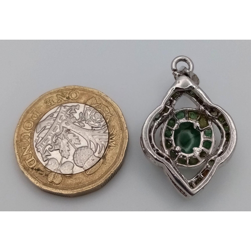 1662 - A Fancy Emerald Silver Tone Pendant. HV 2345