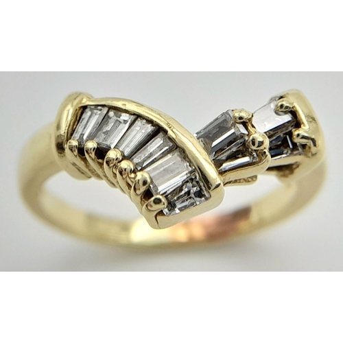 1223 - A 14K Yellow Gold Tapered Baguette Diamond Ring. Chevron form with ten tapered diamonds. Size M. 4g ... 