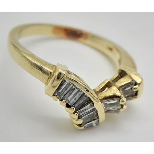 1223 - A 14K Yellow Gold Tapered Baguette Diamond Ring. Chevron form with ten tapered diamonds. Size M. 4g ... 