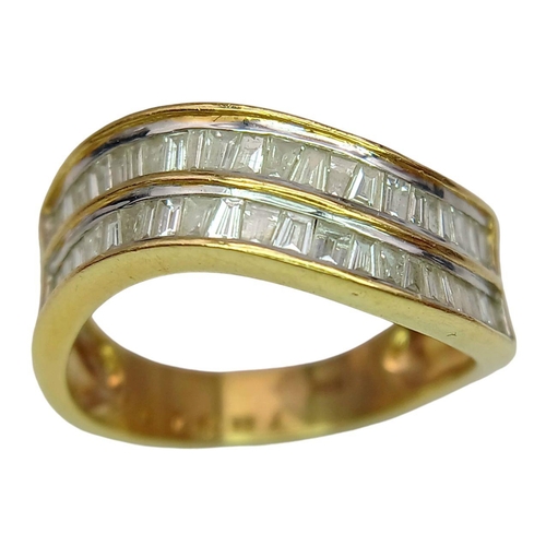 1216 - An 18K Yellow Gold Tapered Baguette Diamond Crest Ring. Two rows of undulating diamonds - 0.80ctw. S... 