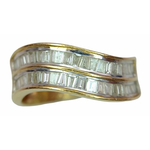 1216 - An 18K Yellow Gold Tapered Baguette Diamond Crest Ring. Two rows of undulating diamonds - 0.80ctw. S... 