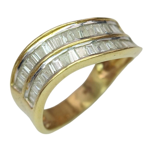 1216 - An 18K Yellow Gold Tapered Baguette Diamond Crest Ring. Two rows of undulating diamonds - 0.80ctw. S... 