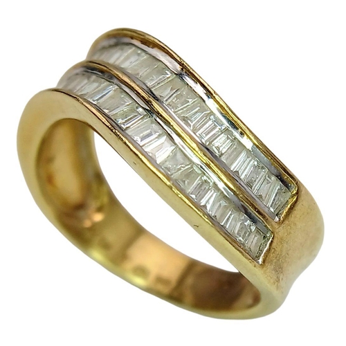 1216 - An 18K Yellow Gold Tapered Baguette Diamond Crest Ring. Two rows of undulating diamonds - 0.80ctw. S... 