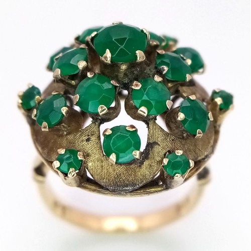 1278 - A Vintage 14k Yellow Gold Emerald Ring. 20 graduating emeralds in circular floral form. Size L 1/2. ... 