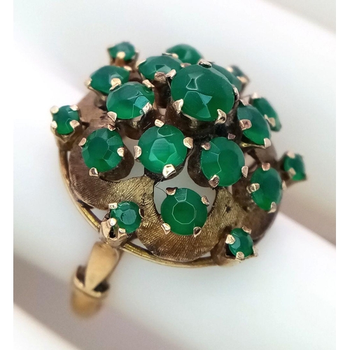 1278 - A Vintage 14k Yellow Gold Emerald Ring. 20 graduating emeralds in circular floral form. Size L 1/2. ... 