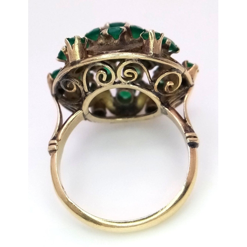 1278 - A Vintage 14k Yellow Gold Emerald Ring. 20 graduating emeralds in circular floral form. Size L 1/2. ... 