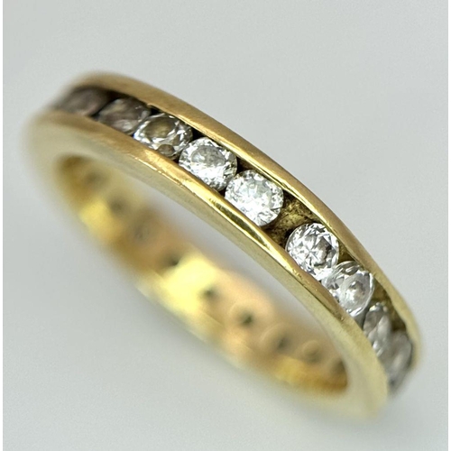 123 - AN 18K YELLOW GOLD DIAMOND SET FULL ETERNITY RING. 0.40CTW. 2.8G. SIZE H. SC5057