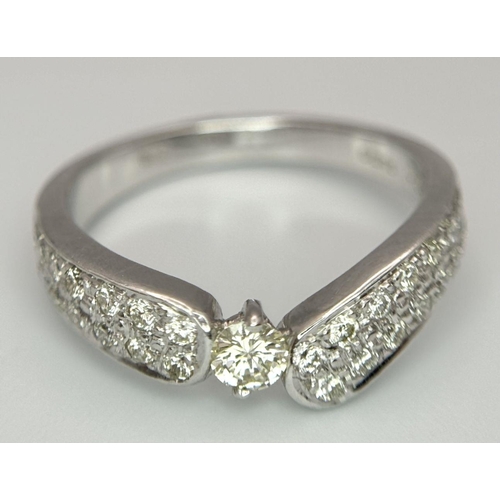 137 - AN 18K WHITE GOLD DIAMOND RING - 0.55CT. 3.9G. SIZE M.
SC5064.