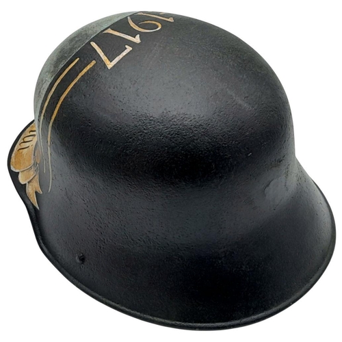 194 - A WW1 Imperial German 1916 Model Stahlhelm Helmet, with a post War memorial painting to the Battle o... 