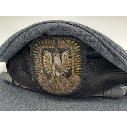 215 - A WW2 Polish Airforce in Exile Pilots Peaked Cap. A British RAF Cap with a Polish Officers Bullion B... 