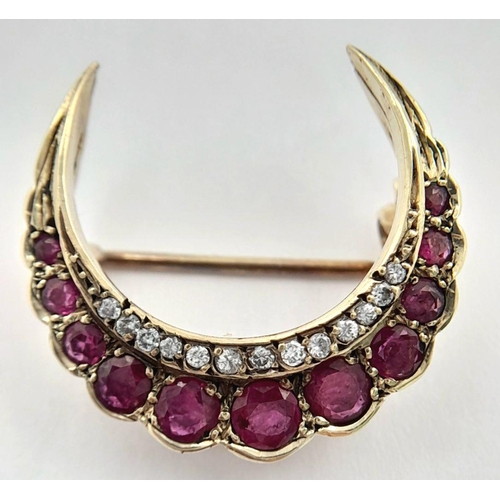 235 - A 9K YELLOW GOLD DIAMOND AND RUBY HALF MOON BROOCH. 3.9G. SC5016.