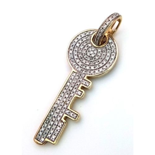 258 - A 9K YELLOW GOLD ( TESTED ) DIAMOND SET KEY PENDANT. 0.50CT. 2.3G. SC5015