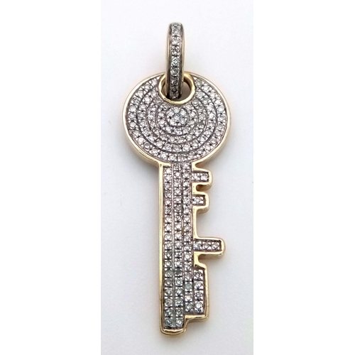 258 - A 9K YELLOW GOLD ( TESTED ) DIAMOND SET KEY PENDANT. 0.50CT. 2.3G. SC5015