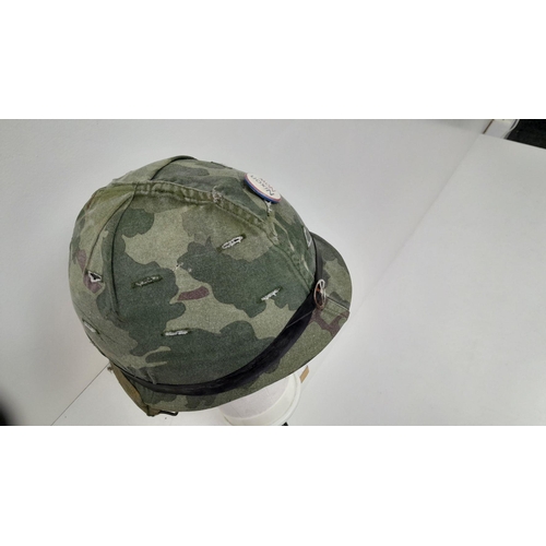 294 - A Vietnam War Era US M1 Helmet with liner and reversible camouflage Cover.