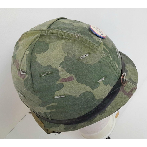 294 - A Vietnam War Era US M1 Helmet with liner and reversible camouflage Cover.