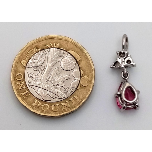 296 - A Delightful Pink Sapphire and Diamond Petit Pendant - Set in platinum. 2cm. 1.5g total weight.