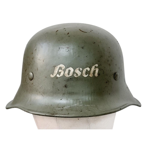 301 - A WW2 German M24 Civil Defence Helmet with Hannover Decal and the Bosh Factory Logo.