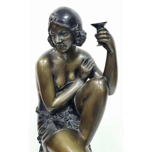 309 - A Vintage Bronze of a Stylish Art Deco Woman Holding a Champagne Glass - seated on a decorative stoo... 