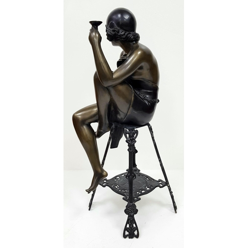 309 - A Vintage Bronze of a Stylish Art Deco Woman Holding a Champagne Glass - seated on a decorative stoo... 