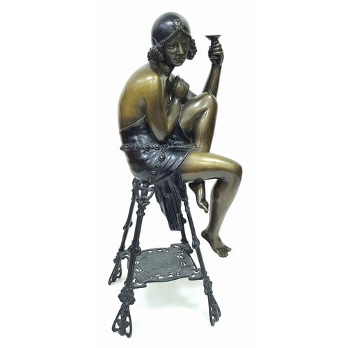 309 - A Vintage Bronze of a Stylish Art Deco Woman Holding a Champagne Glass - seated on a decorative stoo... 