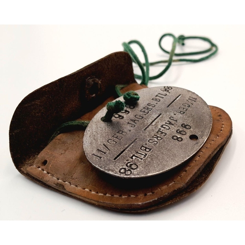 356 - A WW2 German Mountain Troop Soldiers Dog Tag in a leather Pouch to prevent the cold metal from touch... 